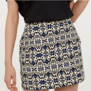 H&M Aztec Print Mini Skirt. Size 4. Beige with black and cobalt print.